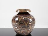 a vase that is sitting on a black table