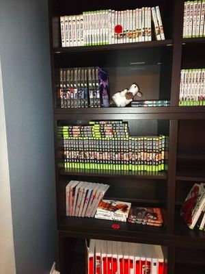a bookshelf with many different types of dvds on it
