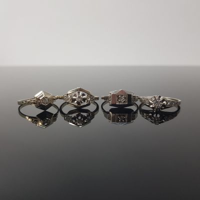three different rings on a black surface with a white background