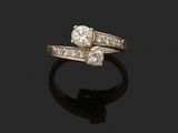 an 18k gold and diamond bypass ring