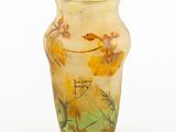 a glass vase with yellow flowers painted on it