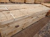 several stacks of wooden planks stacked on top of each other