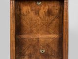 a wooden cabinet with two drawers and a marble top