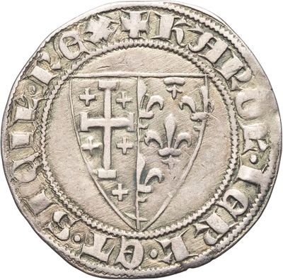Gros plan sur une pièce de monnaie portant des armoiries