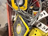 a pile of assorted items in a shopping cart