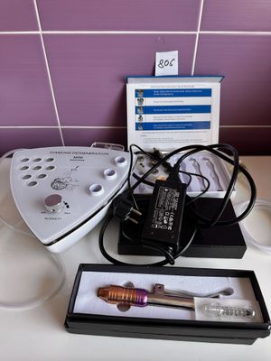 a white counter top with a blender and other items on it