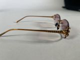 two pairs of glasses sitting on top of a white table
