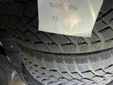 a close up of a car tire with a sticker on it
