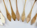 a lot of spoons that are sitting on a table
