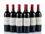 six bottles of red wine are lined up in a row