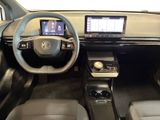the interior of a car with a steering wheel, dashboard, and a touch screen