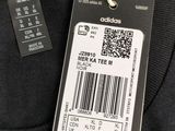 a close up of a black shirt with a barcode on it