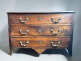 an old wooden chest of drawers with brass handles and knobs