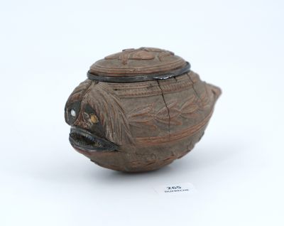 a small brown vase with a lid on a white surface