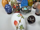many different types of glass vases sitting on a table