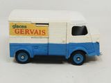 a small toy truck with a sign on the side of it