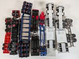 a lot of toy trucks that are sitting on a table