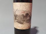 a bottle of wine that is sitting on a table