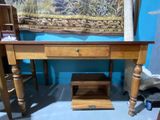 a wooden desk with a drawer underneath it in a room