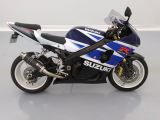 a picture of a suzuki motorcycle parked on a white floor