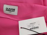 a close up of a pink shirt with a label on it