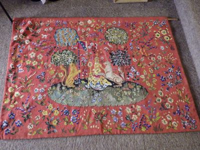 a rug with a picture of a woman and a dog on it