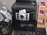 a coffee machine sitting on a counter in a kitchen