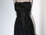 black strapless dress on a mannequin display on a mannequin stand
