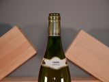 a bottle of wine that is sitting on a table