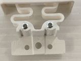 a close up of a pair of screws on a white surface