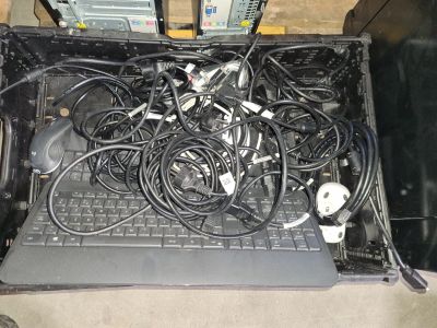 a laptop with a bunch of wires on top of it