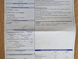 a close up of a piece of paper on a wooden table