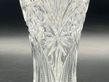 an image of a clear glass vase on a black surface