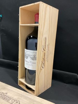 a wooden box with a bottle of wine inside of it