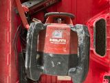 a red tool box with tools in it on the floor