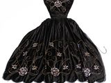 une image représentant une robe noire ornée de fleurs sur fond blanc