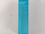 a close up of a tube of toothpaste on a white surface