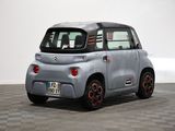 an image of a small electric car on a checkered floor