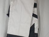 the back of a pair of white pants hanging on a clothes rack