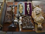 a table with a lot of religious items on it