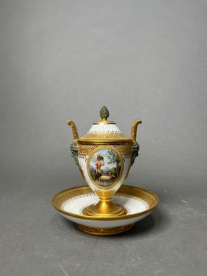 a cup and saucer on a saucer on a plate