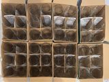 several boxes of glasses are stacked on top of each other