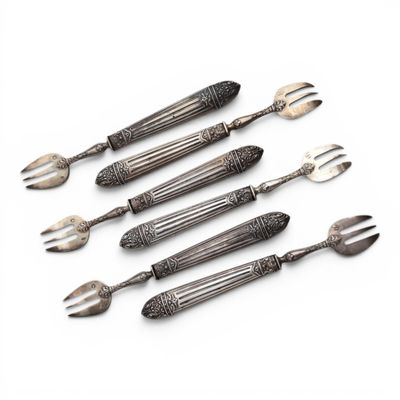 five forks and a knife are arranged in a row on a white surface