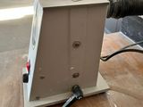 a machine that is sitting on top of a wooden table