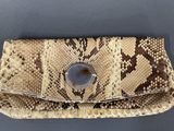 an image of a snake skin purse on a table