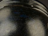 a close up of a helmet on a black background