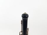 a close up of a black and silver clarinet on a white background