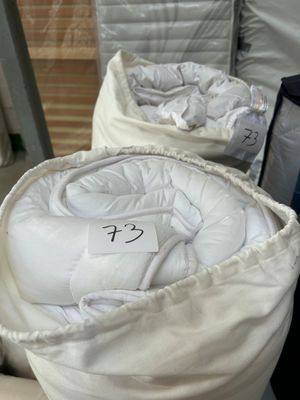 two bags of bedding sitting on a table