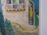 a painting on the wall of a house with a woman standing in front of it