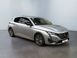 the silver car is parked in a large room with a white wall